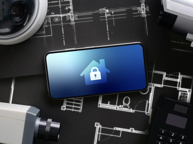 Phone with home security image on the screen on a black background